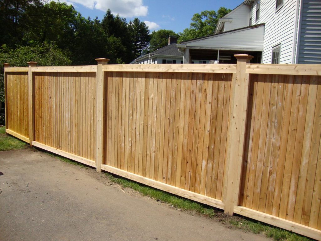 Universal tongue and groove with colonial cap cedar posts Reliable Fence